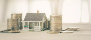 Model image if a house with stacks of one dollar coins